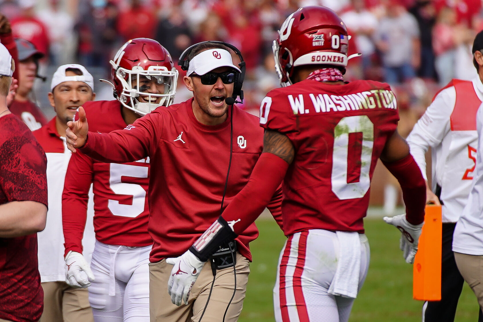 Lincoln Riley and Woodi Washington